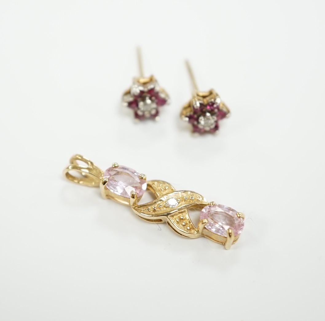 A modern 9ct gold and gem set pendant, 25mm and pair of similar ear studs, gross weight 2.8 grams.